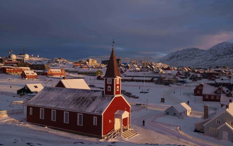 A man walks near the church in Nuuk, Greenland, on Wednesday, Jan. 14, 2026. (AP Photo/Evgeniy Maloletka)